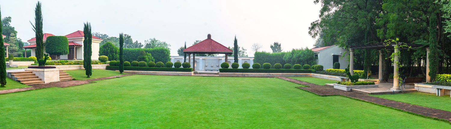 Main lawn featuring English & European formal garden styles, an ideal setting for destination wedding places.