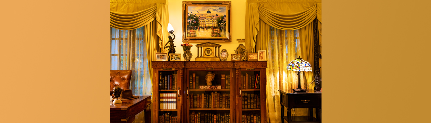 Private library adorned with leather-bound books on various subjects, a sophisticated touch for luxury wedding venues.