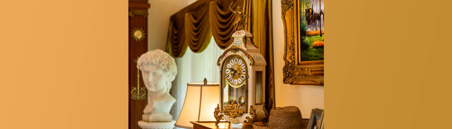 Palace is adorned with 100-year-old antique mantel clocks, creating timeless ambiance for a destination wedding in Hyderabad.